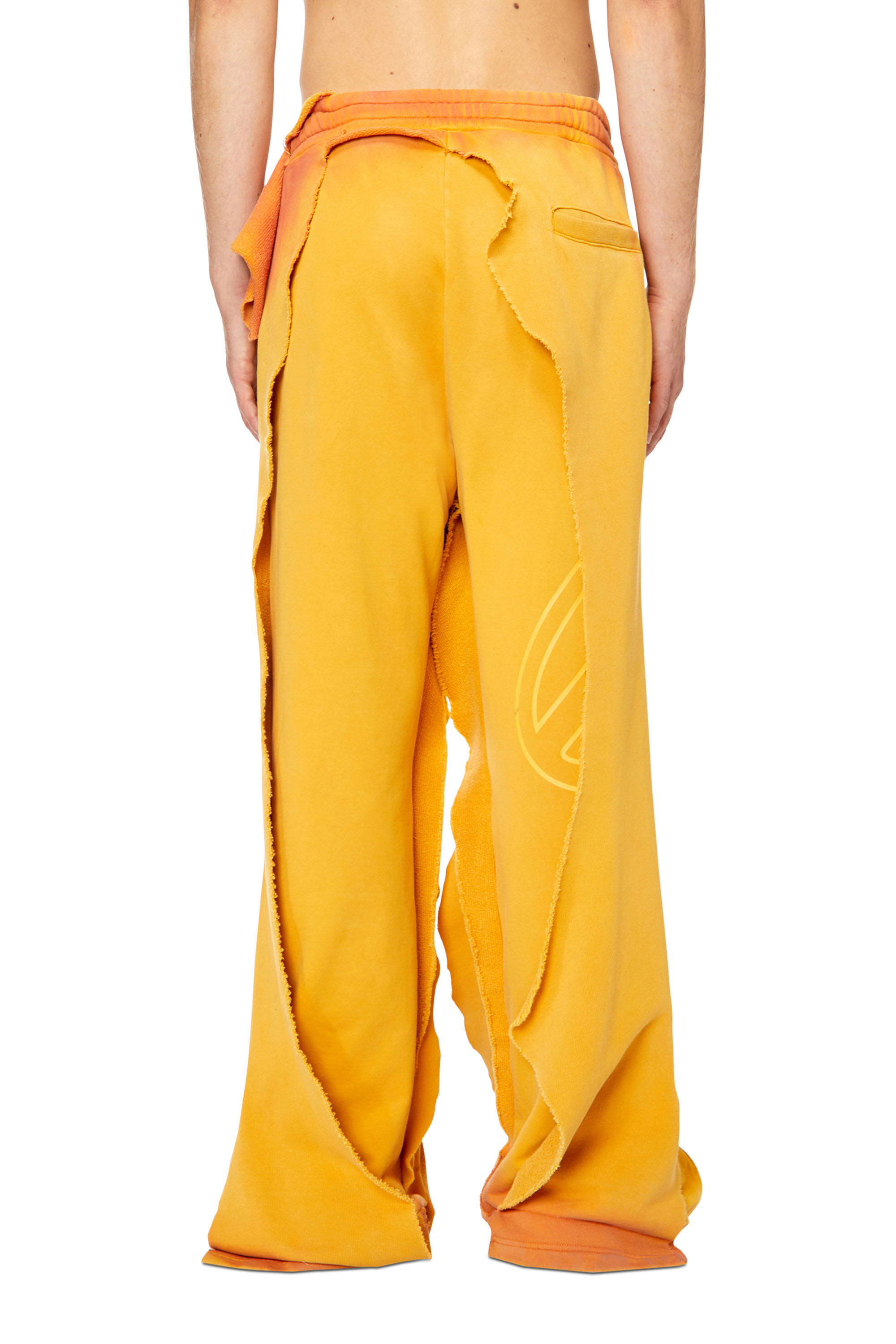 P-TOPAHOOP Man: Ripped and dyed dual-layer track pants | Diesel