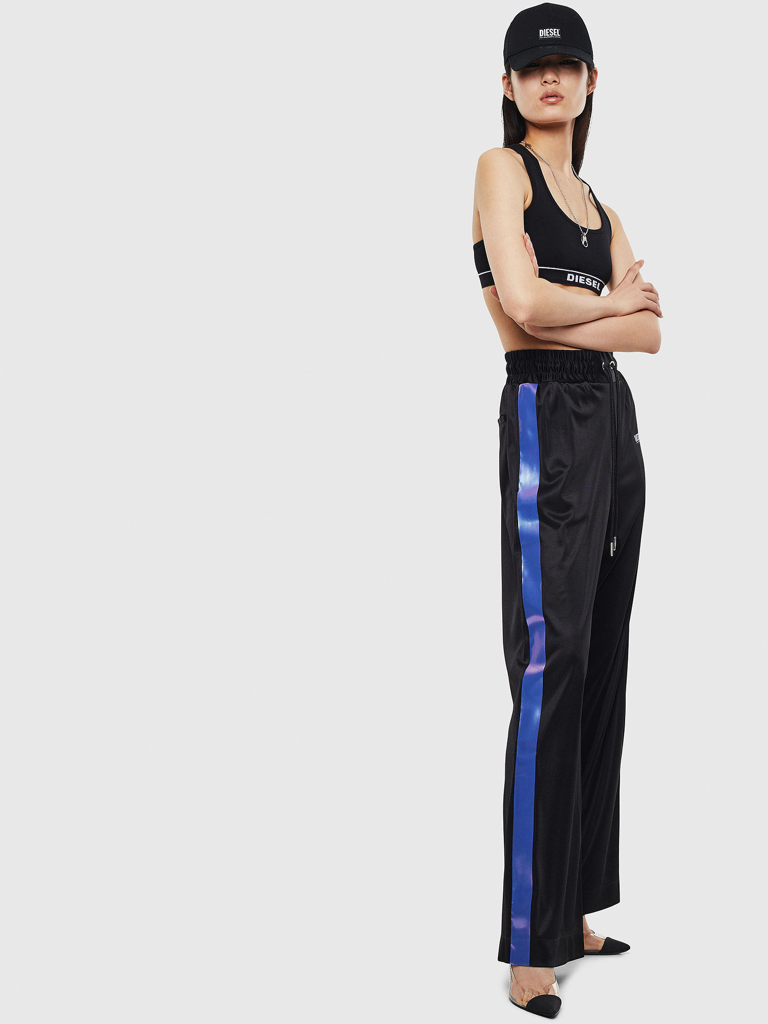 These track pants have buttons on the side that can be opened. They are  called popper pants.
