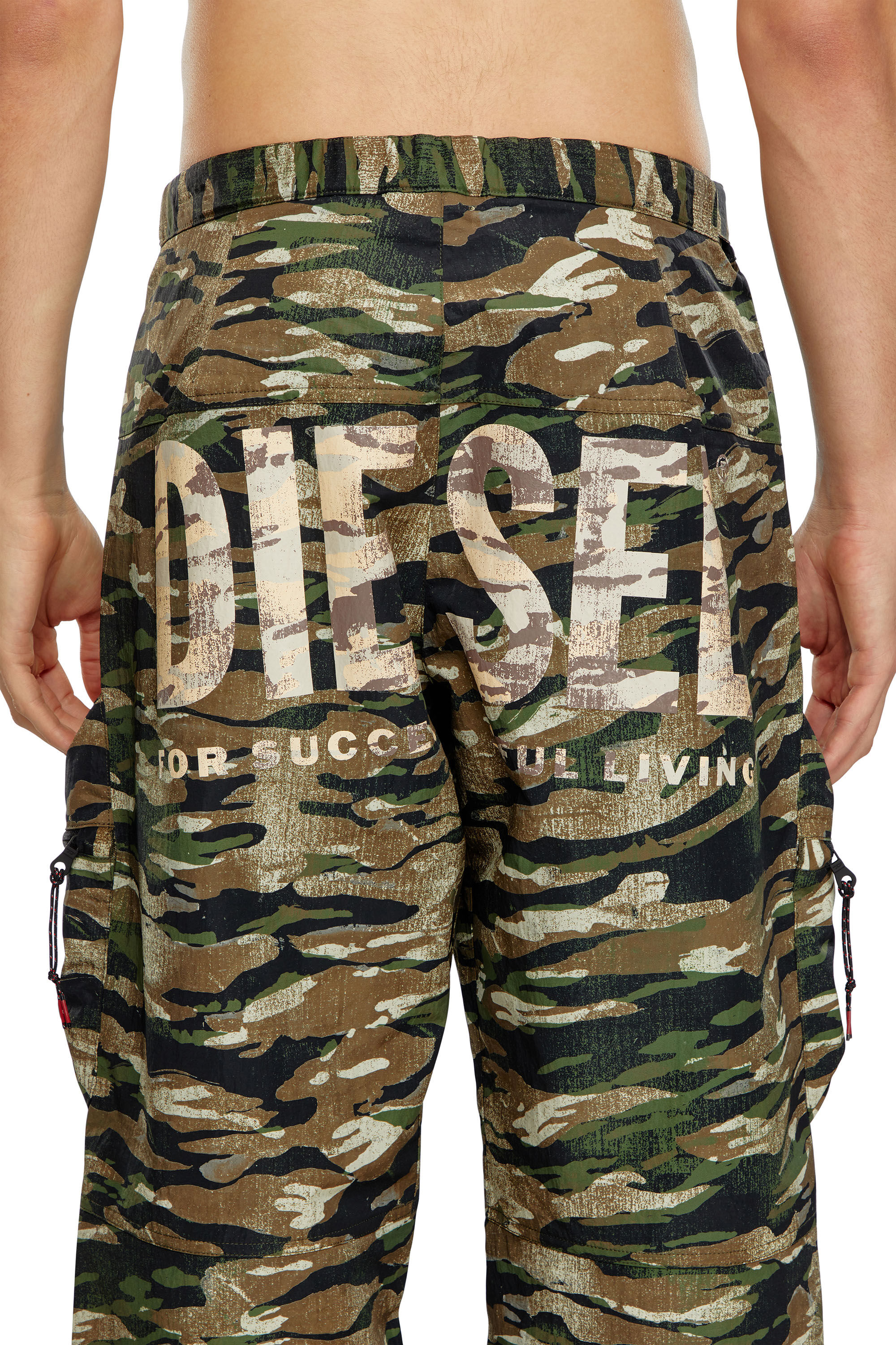 Men's Nylon cargo pants with worn camo print | Multicolor
